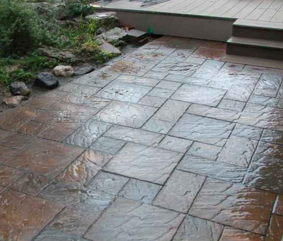 Outdoor patio stamped with a brick paver design.
