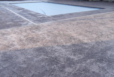 Gray pool deck textured concrete.