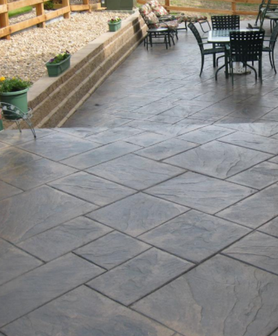 Stamped concrete squares for a porch, steps and patio.