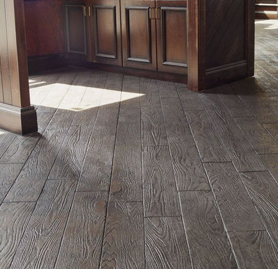 Interior floor stamped as wood grain planks.